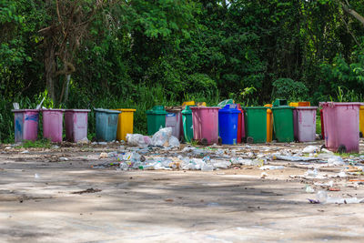 Plastic bins were left in the garbage collection area. pollute