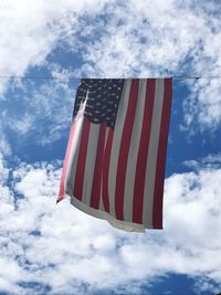 Low angle view of flag against sky