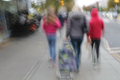 Blurred motion of people walking on bus