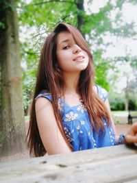 Portrait of beautiful young woman looking down