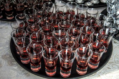 Close-up of wine glasses on table