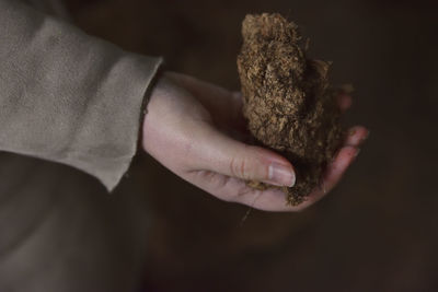 Close-up of woman holding marijuana