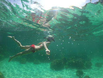 Full length of woman swimming in sea