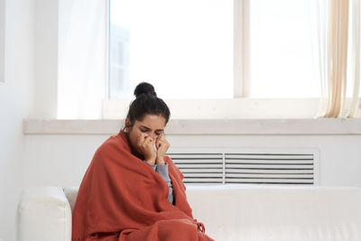 Sick woman resting at home