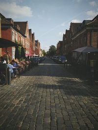 Narrow street along buildings