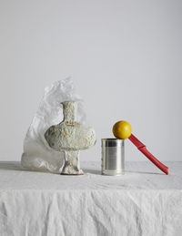 Close-up of fruits on table against white background