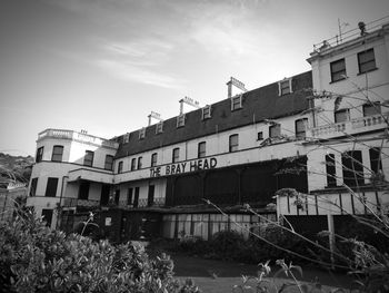 Low angle view of abandoned buildings against sky