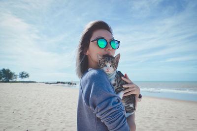 Portrait of young woman holding a beach