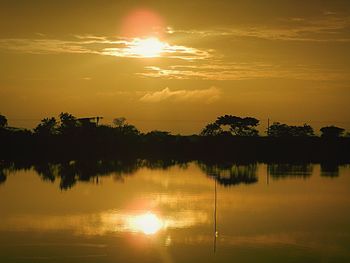 Scenic view of lake against sky during sunset