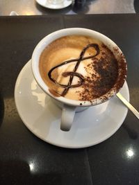 Close-up of coffee cup on table