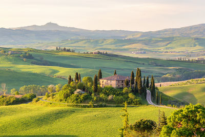 House on a hill in tuscany landscape