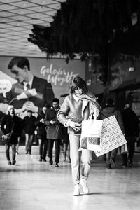 Woman with umbrella in city