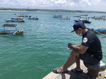 Man sitting in sea