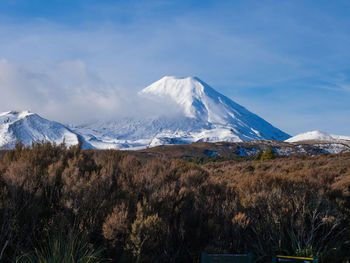 Idyllic view of snowcapped mountains against sky