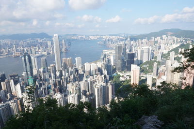 High angle view of modern buildings in city against sky