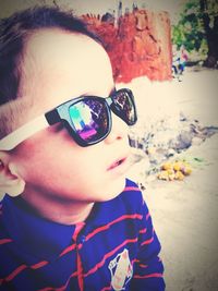 Close-up portrait of boy wearing sunglasses