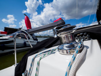 Close up view of yacht winch with rope, sailboat equipment