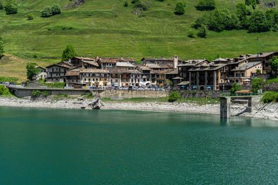 The village of pontechianale and its lake, piedmont, italy