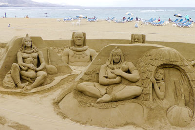 Statue of people on beach