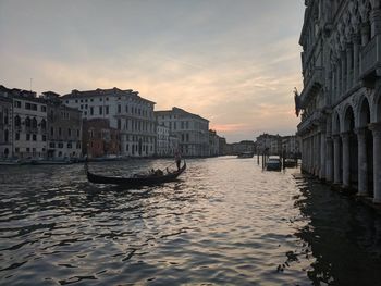 Canal passing through city buildings