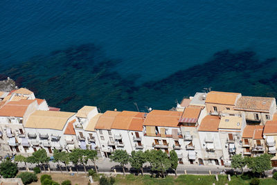 High angle view of townscape by sea