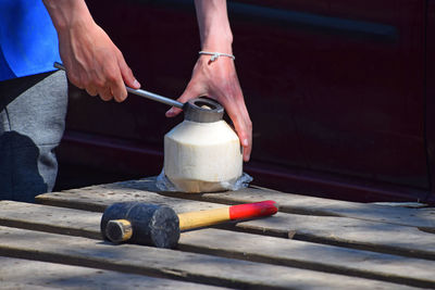 Close-up of man working on wood