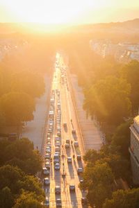 High angle view of vehicles on road at sunset