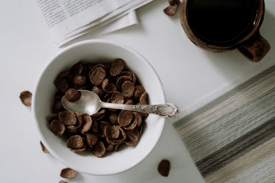 High angle view of chocolate cereals in glass on table