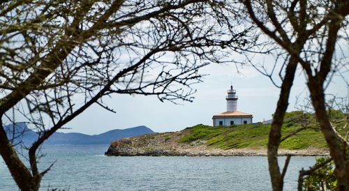 Scenic view of sea against sky with light house