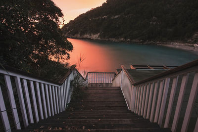 High angle view of staircase by lake