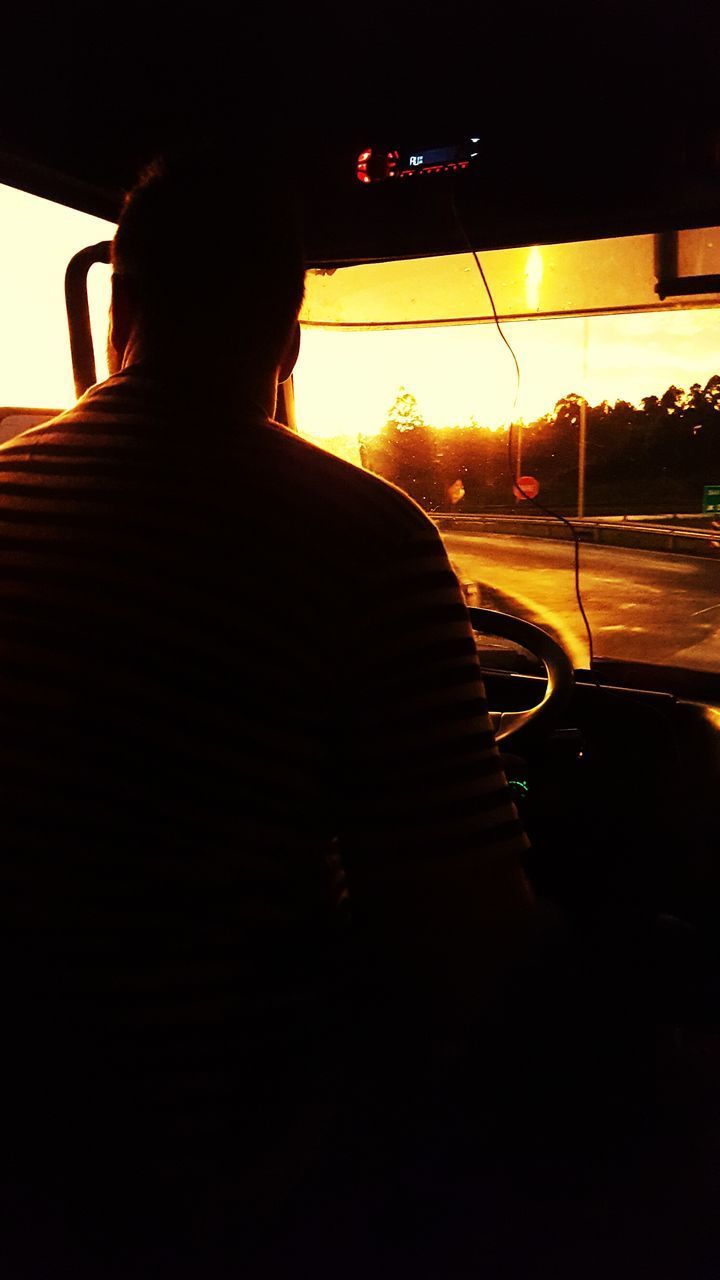 REAR VIEW OF SILHOUETTE PERSON IN CAR