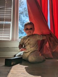 Portrait of cute girl sitting on table