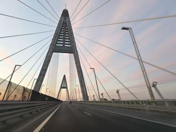 View of bridge over road in city