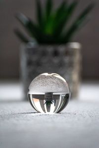 Close-up of crystal ball on metal