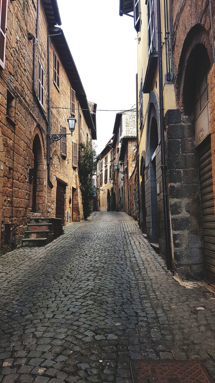 NARROW ALLEY ALONG OLD BUILDINGS