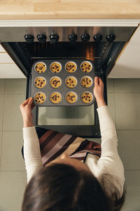 High angle view of woman preparing food at home