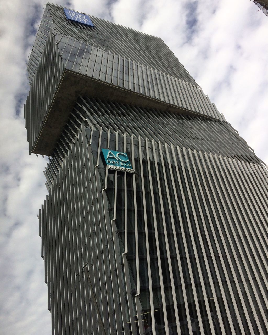 low angle view, architecture, sky, built structure, cloud - sky, building exterior, cloud, modern, cloudy, outdoors, day, blue, no people, office building