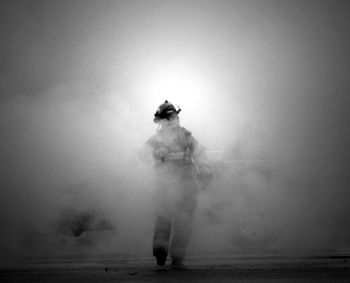 Blurred motion of woman standing in park