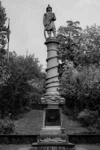 Low angle view of statue against sky