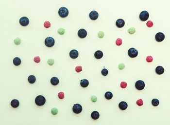 High angle view of candies against white background