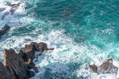 Waves splashing on rocks