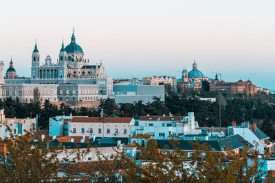 View of the buildings of the city on a sunny day. real palace at the bottom. madrid, spain