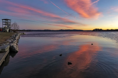 Scenic view of lake against sky during sunset