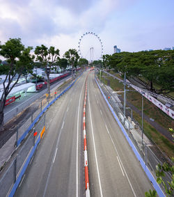 High angle view of vehicles on road against sky