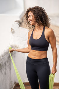 Smiling woman standing outdoors