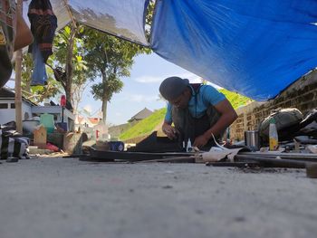 People working on vehicle