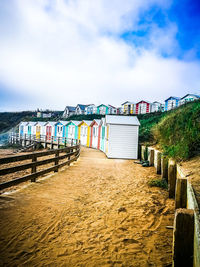 Beach huts against sky