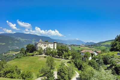 Panoramic shot of building and trees against sky