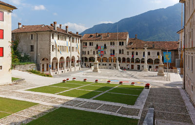 Buildings in town against sky