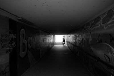 Rear view of man in tunnel